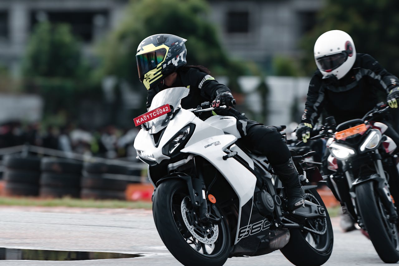 Exciting motorcycle race on a dirt track in Bengaluru, India featuring skilled riders.